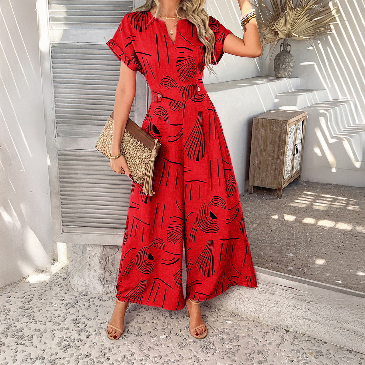 Printed casual vacation style waist cinching short sleeved wide leg jumpsuit long pants