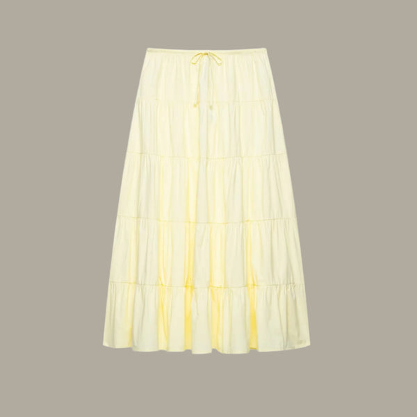Solid color waist tie with layered patchwork half length skirt
