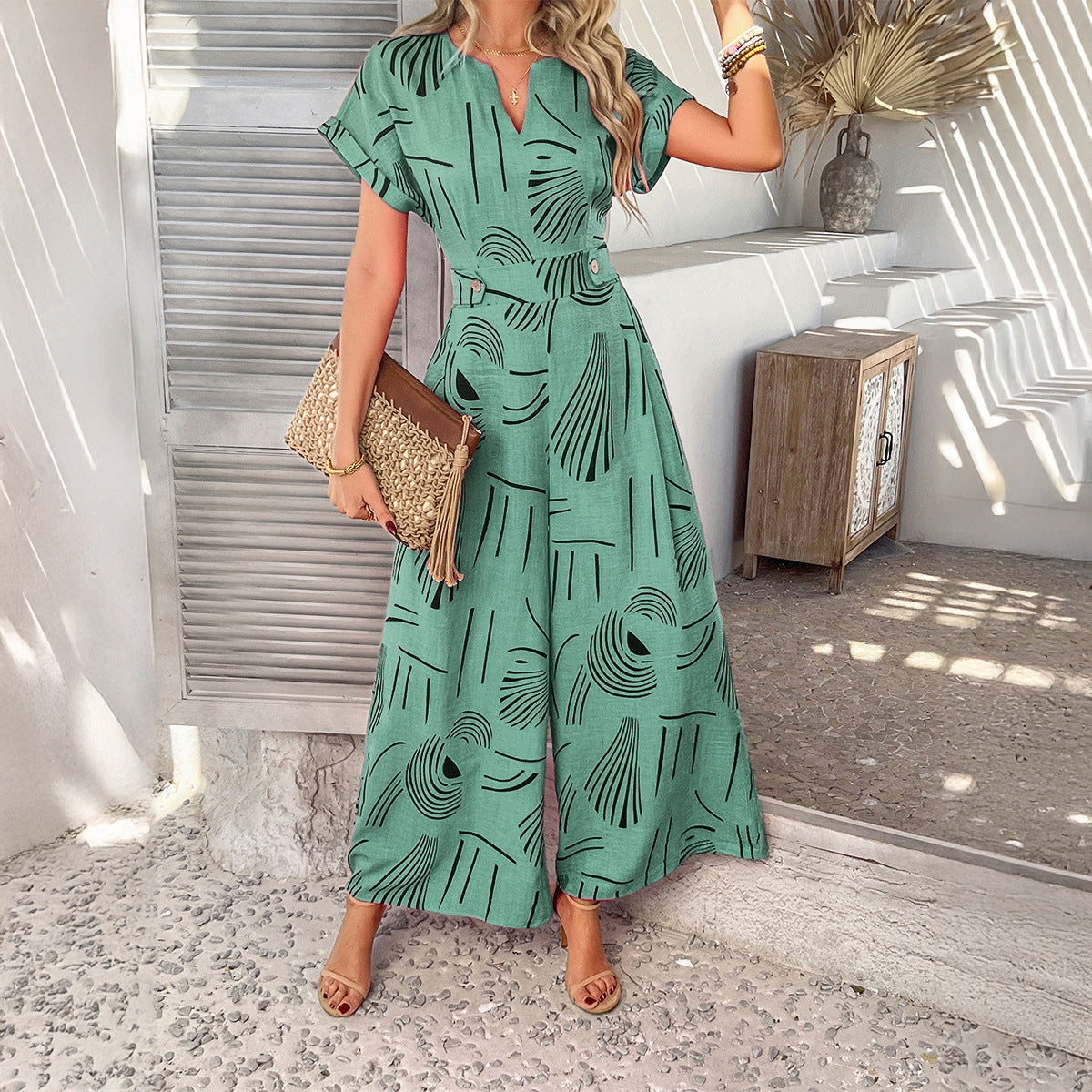 Printed casual vacation style waist cinching short sleeved wide leg jumpsuit long pants